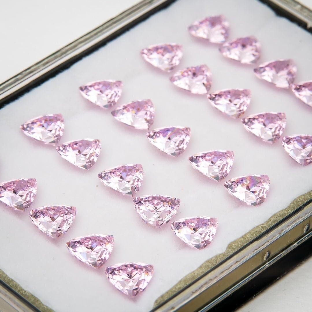 Set of 25 light pink trillion shaped high carbon cubic zirconia gemstones