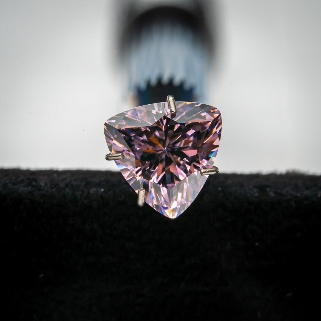 Set of 25 light pink trillion shaped high carbon cubic zirconia gemstones
